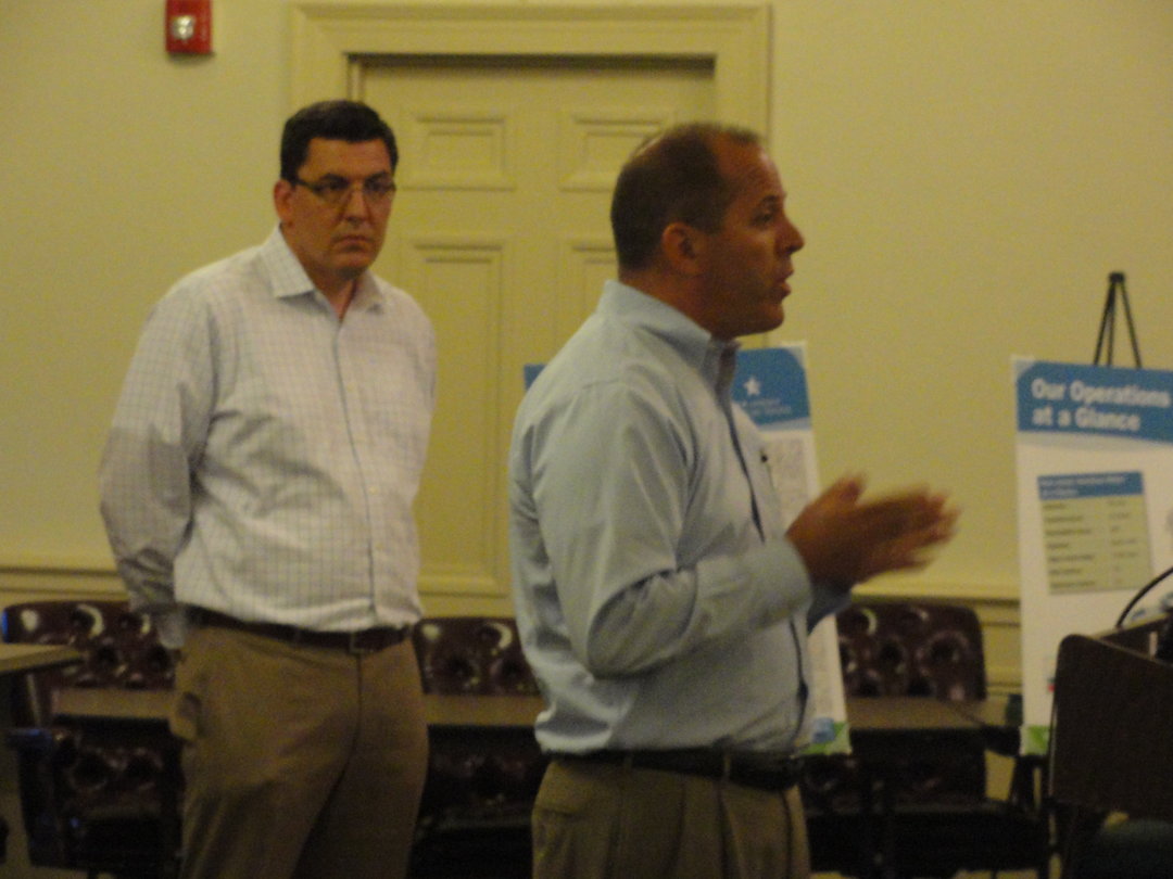 Representatives from New Jersey American Water addressed Haddonfield residents about the proposal to purchase their water and sewer system on Wednesday. Carmen Tierno (right) said there could be staffing changes as a result of the sale. Credit: Matt Skoufalos.