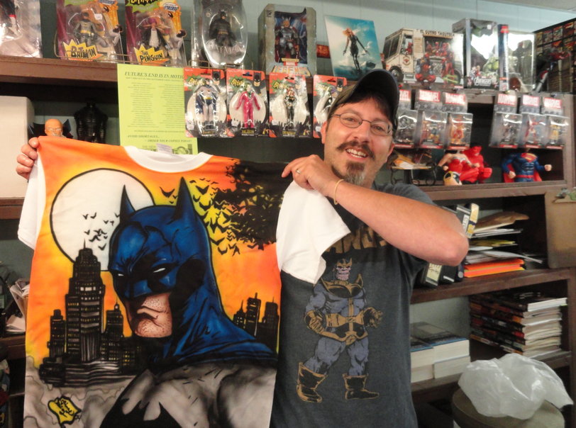 Brian Rappa shows off a custom-made Batman t-shirt at Fat Jack's Comicrypt in Oaklyn. Credit: Matt Skoufalos.