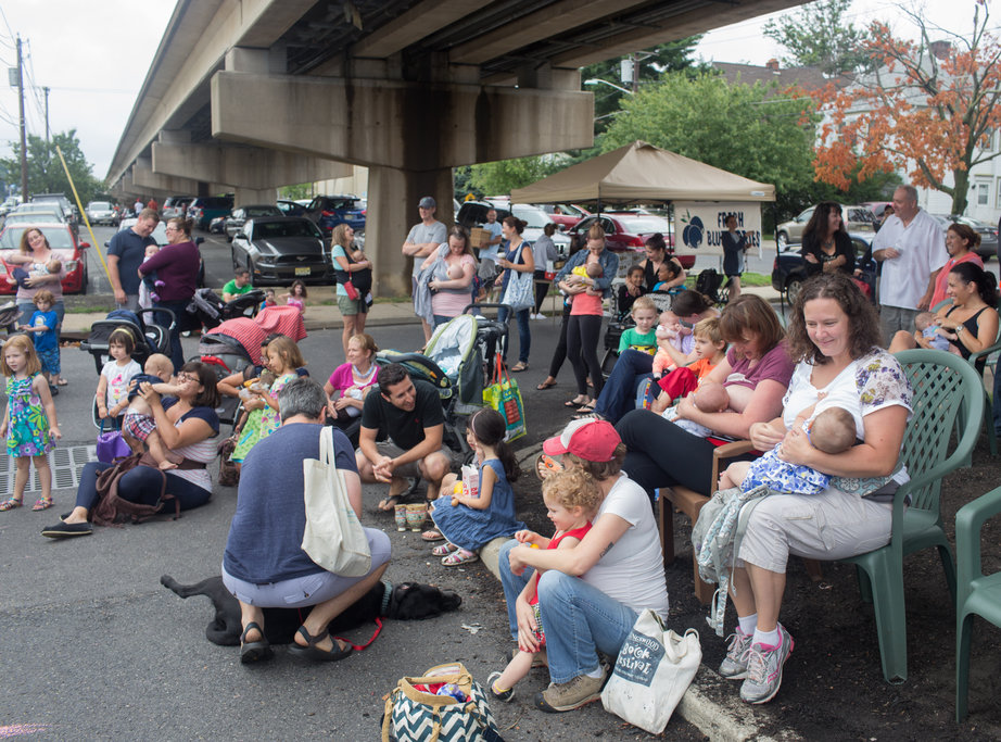 Some 15 moms and babies held a symbolic breastfeeding 'latch-on' Saturday at the Collingswood Farmers Market. Credit: Tricia Burrough & Lilac Blossom Photography.